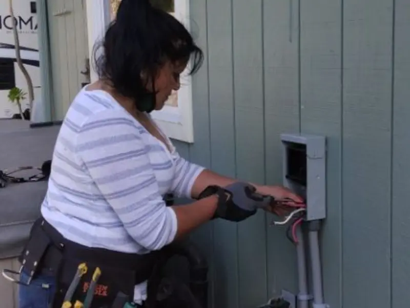 Licensed electrician wiring an exterior subpanel in Valparaiso
