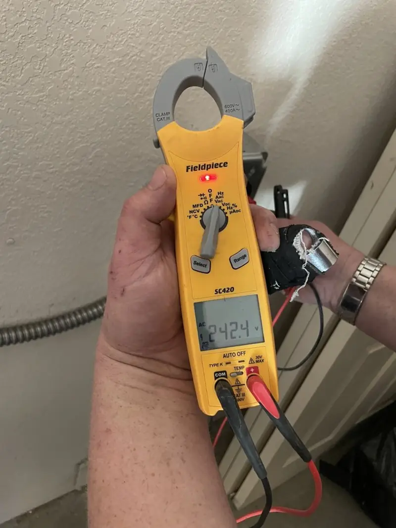 Voltage testing with clamp meter during Outlet Installation in Valparaiso